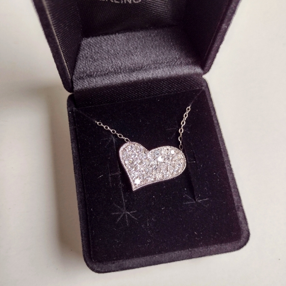 925 Sterling Silver Heart Charm and with 16" Chain.